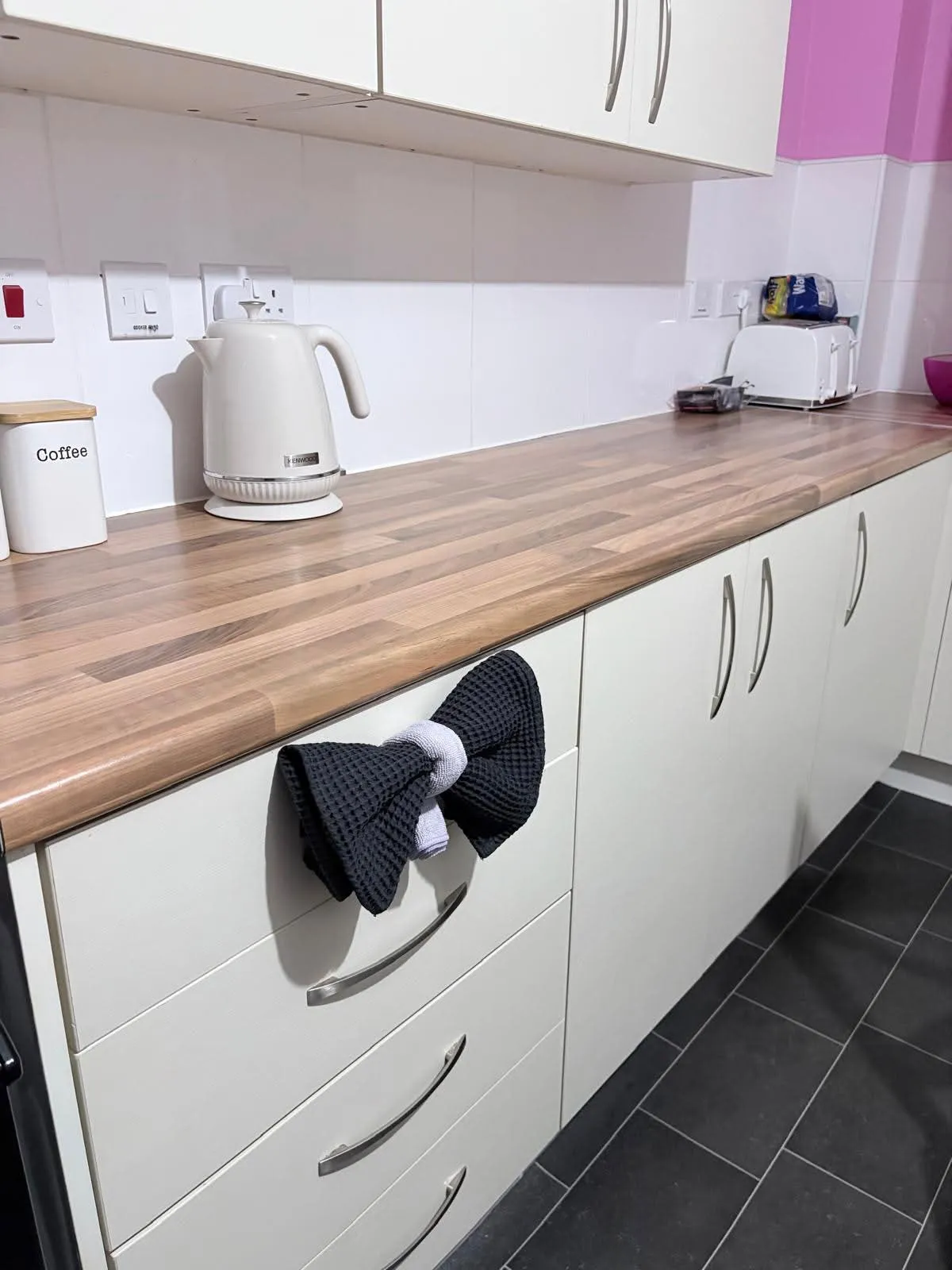 Neatly folded tea towel on a spotless kitchen counter